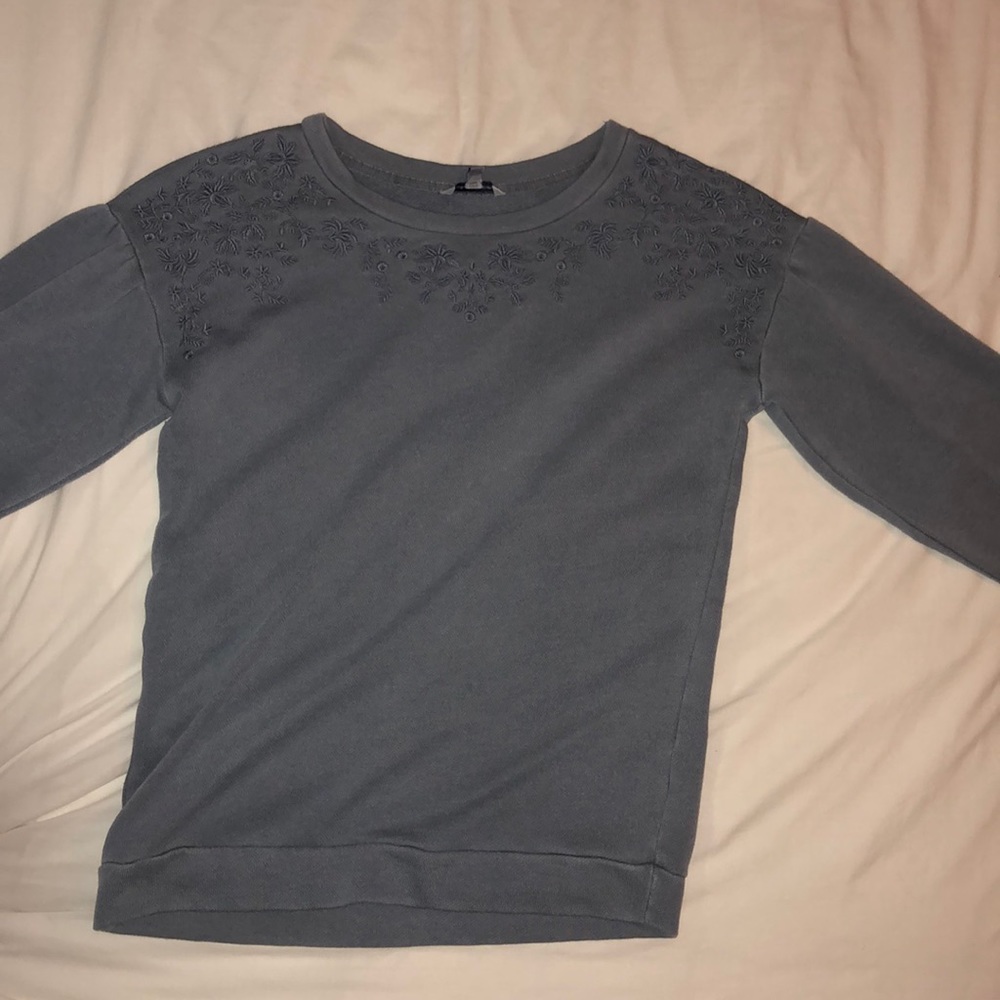 sweatshirt with embroidered flowers around neck